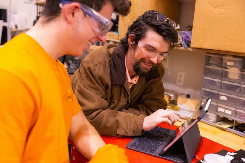 student and professor working in lab