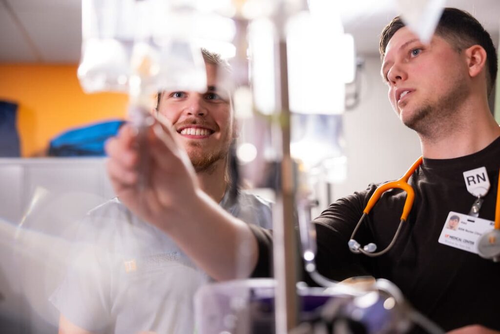 two male nurses training